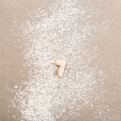 Figure SEVEN made of raw dough on flour