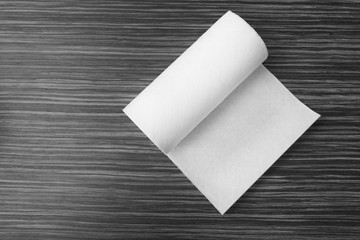 Roll of paper towels on table, top view