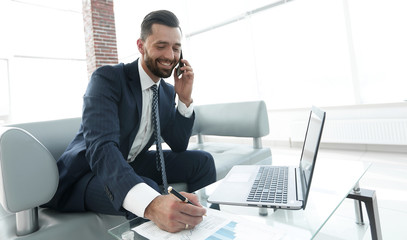 Businessman discussing on a smartphone, business issues