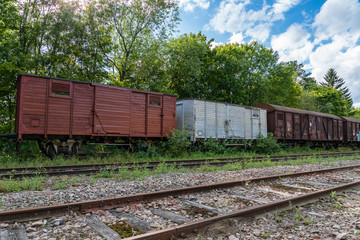 Fototapeta premium Old abandoned cargo train set standing on some old tracks