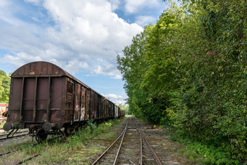 Old train set standing on an old railroad track in Sweden