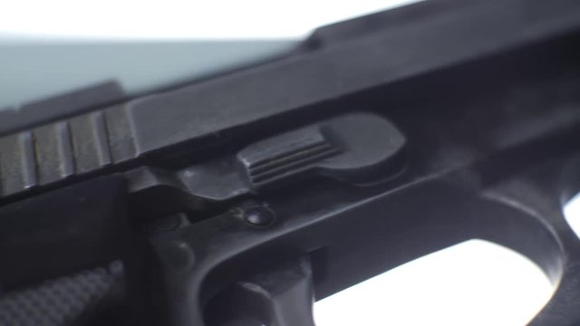 CSI expert table - gun close up, close up automatic pistol handgun weapon on white background