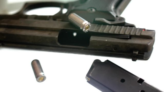 CSI expert table - gun close up, close up automatic pistol handgun weapon on white background