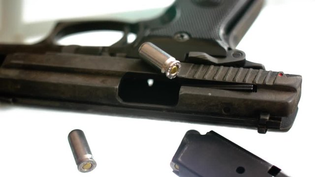 CSI expert table - gun close up, close up automatic pistol handgun weapon on white background