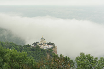 Naklejka premium Top view Church of Holy Resurrection of Christ on Red cliff and township Foros on Black sea coast, Crimea.