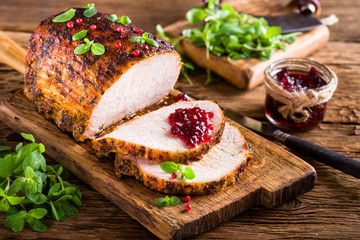 Roasted pork loin with cranberry and marjoram - 194083340