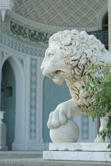 Marble sculpture of lion with ball in Vorontsov Palace in Alupka, Crimea, Russia.