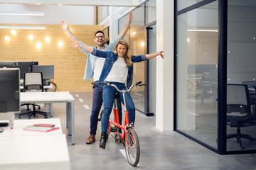 Business people on twin bicycle