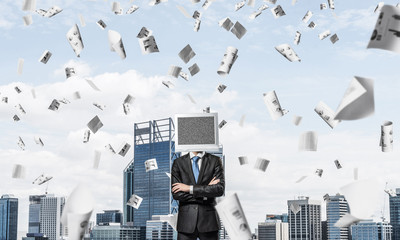 Businessman with monitor instead of head.