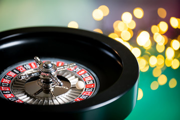 High contrast image of casino roulette and poker chips