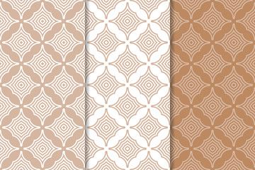 Set of geometric ornaments. Brown and white seamless patterns