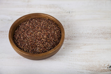 Raw red wild rice in a bowl