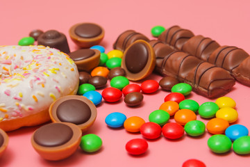 a lot of sweets on a pink background. Candy background. colorful candy and sweets.