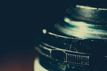 Old manual control lens body. Scratches and dirt. Close-up on the lens bayonet