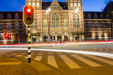 The busy Amsterdam street at night.
