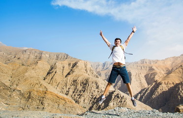 Man jumping on the mountain top