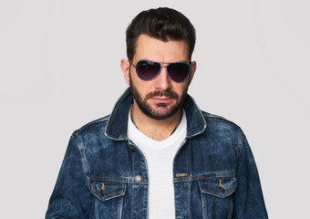 handsome young bearded man in sunglasses