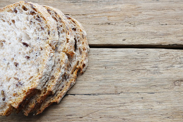 Rustic bread on wooden cutting board as copy space
