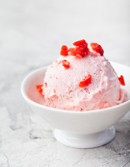 Strawberry sundae ice cream in bowl