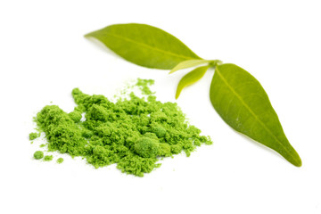 Powdered green tea with leaf on white background.