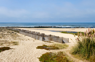 Fototapeta na wymiar Beach with sand fence.