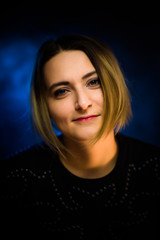 portrait emotional young girl on blue background