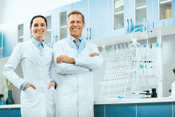 Scientists In Laboratory. Medical Workers At Work