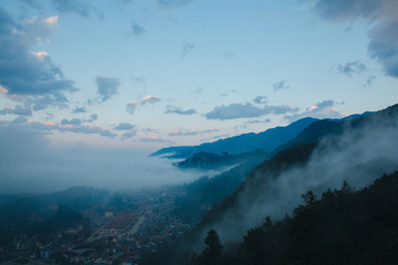 town in beautiful mountains and clouds at evening in Sa Pa, Vietnam