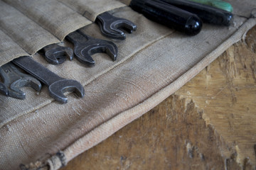 set of wrenches. Focus the set of tools in the workshop. Keys located on the background of the old table