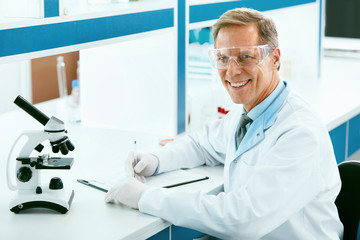 Laboratory. Male Scientist Working At Workplace.