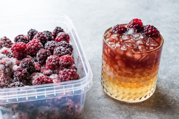Bramble Cocktail with Blackberries and Crushed Ice.