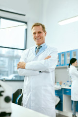 Male Scientist In Laboratory Portrait