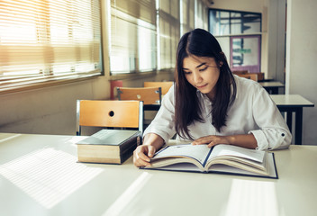 Young woman reading book.