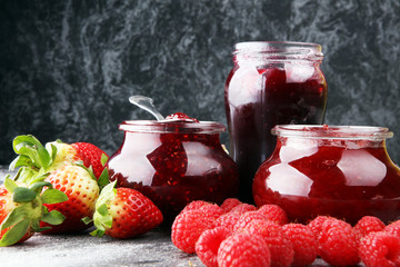 assortment of jams, seasonal berries, mint and fruits