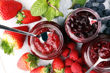 assortment of jams, seasonal berries, mint and fruits
