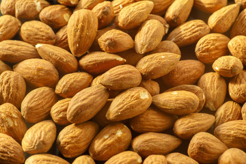 Almonds nuts. A close-up photograph. Unrefined whole kernel 