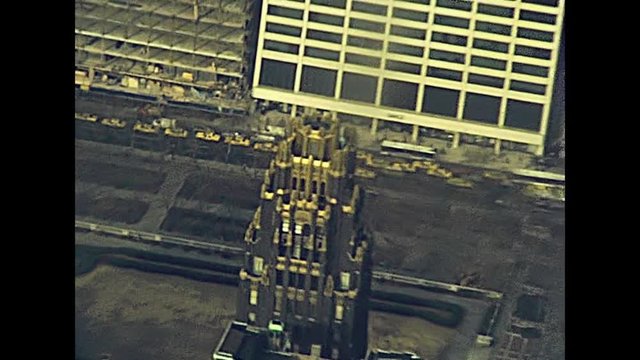 Vintage panorama on the eighties from Empire State Building top terrace, aerial view of typical yellow taxis in the Manhattan traffic. Archival Manhattan skyline in 1981. Vintage America on 80s.