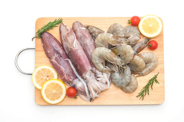 fresh seafood raw (shrimps ,squids) on wooden board