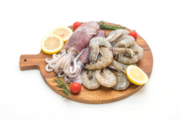 fresh seafood raw (shrimps ,squids) on wooden board