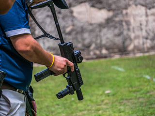 Male carry submachine gun standby for competition