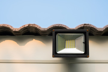 LED flood light, spot light on the roof with blue sky background