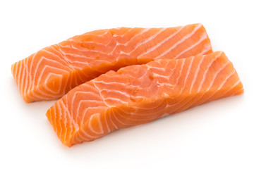 Fresh salmon fillet with basil on the white background.