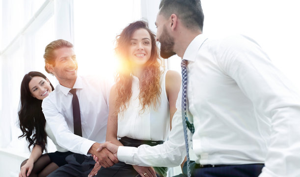 welcome handshake between two colleagues.