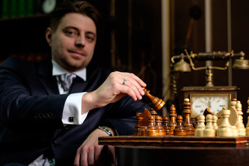 Businessman hand holding a chess
