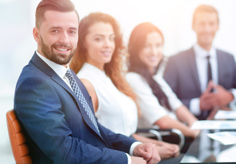 group of business people sitting at the desktop