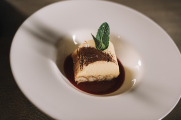 chocolate dessert on plate on wooden table