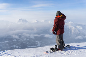 Snowboarder riding Revelstoke Mountain, British Columbia, Canada.