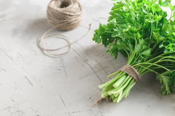 Bunch of parsley on grey concrete background