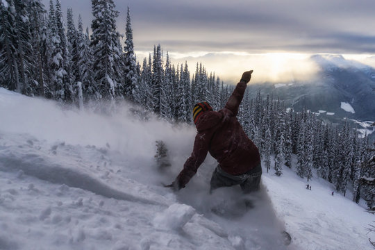 Snowboarder riding Revelstoke Mountain, British Columbia, Canada.