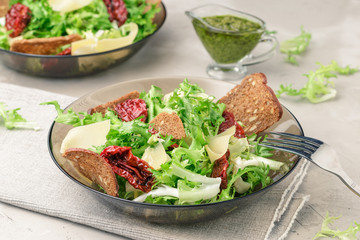 Frisee lettuce salad with sun dried tomatoes